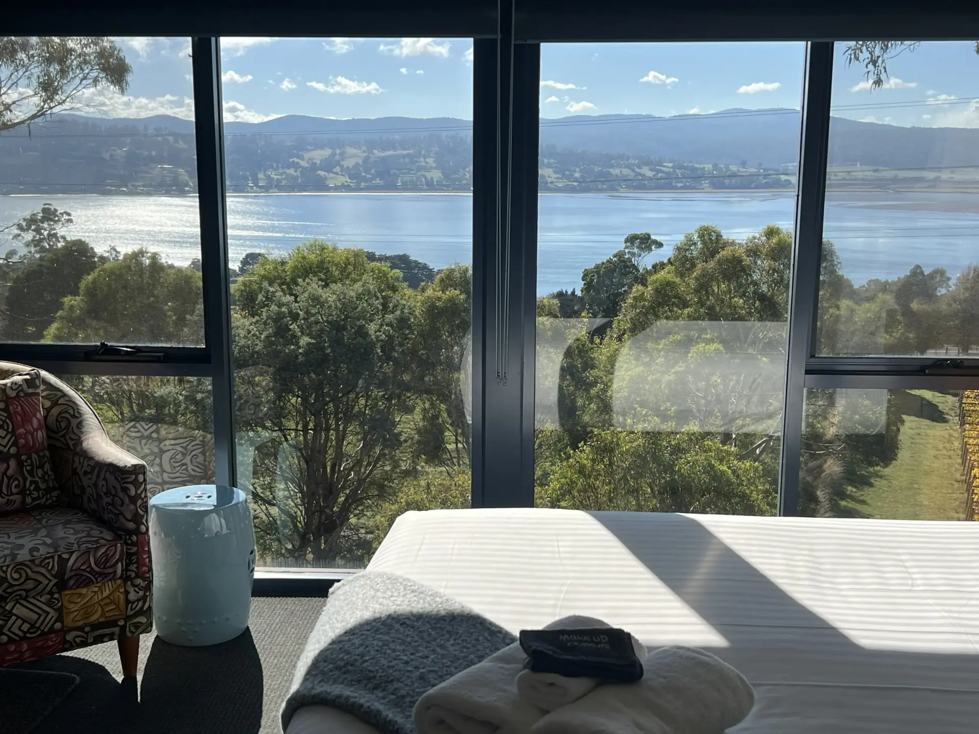 Bedroom with panoramic water and bushland views