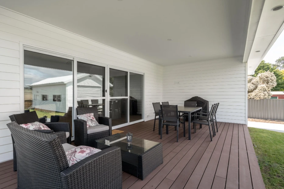 Modern outdoor patio with seating and dining area