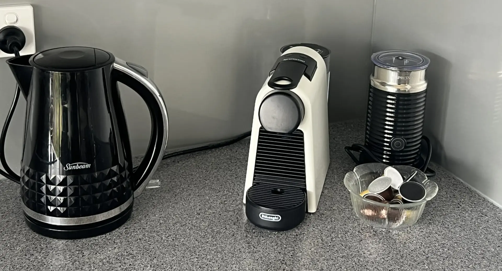 Kitchen counter with kettle and pod coffee machines