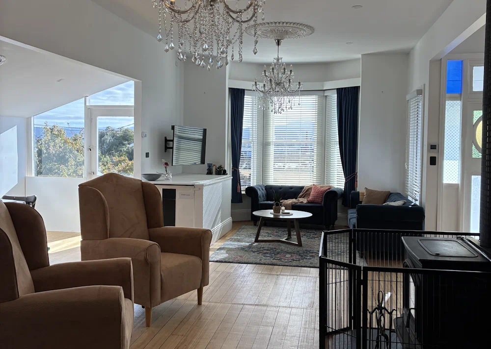 Spacious living room with natural light and furnishings