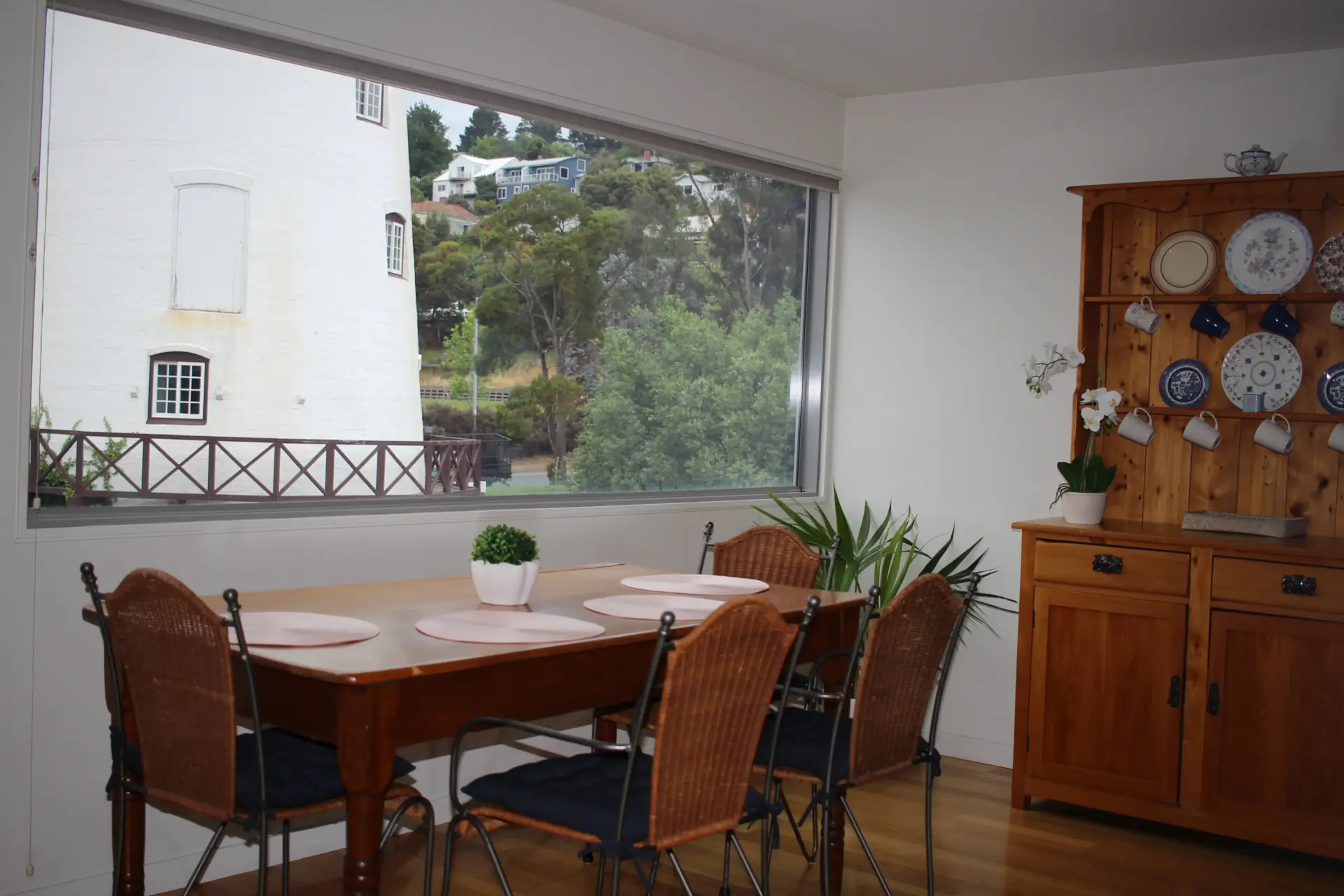 Dining room with wooden table and large window