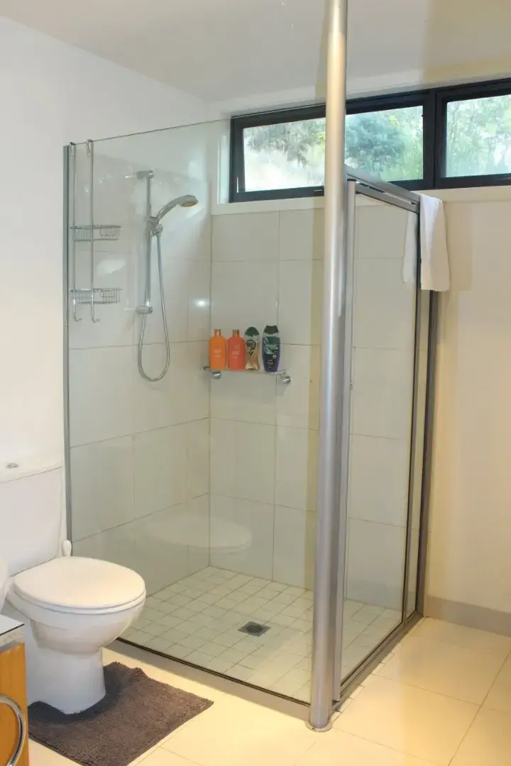 Modern bathroom with glass shower and toilet