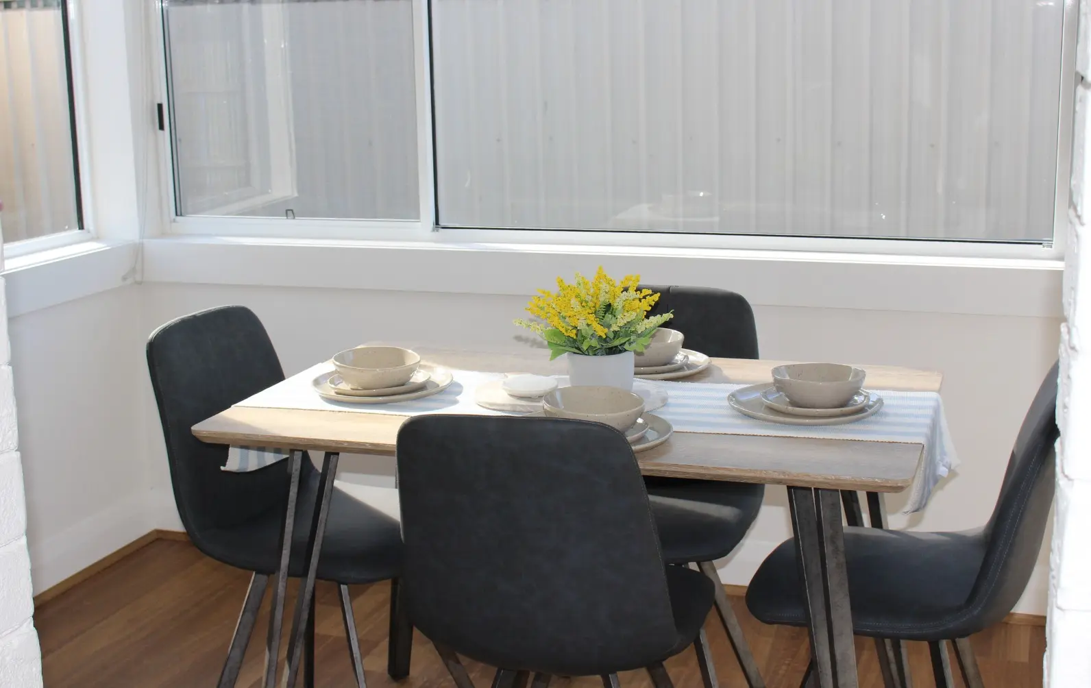 Dining table set with bowls and flowers