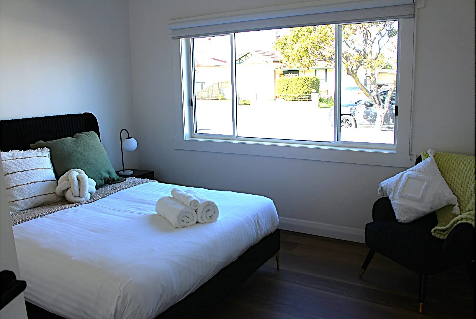 Cozy bedroom with a bed and natural light.