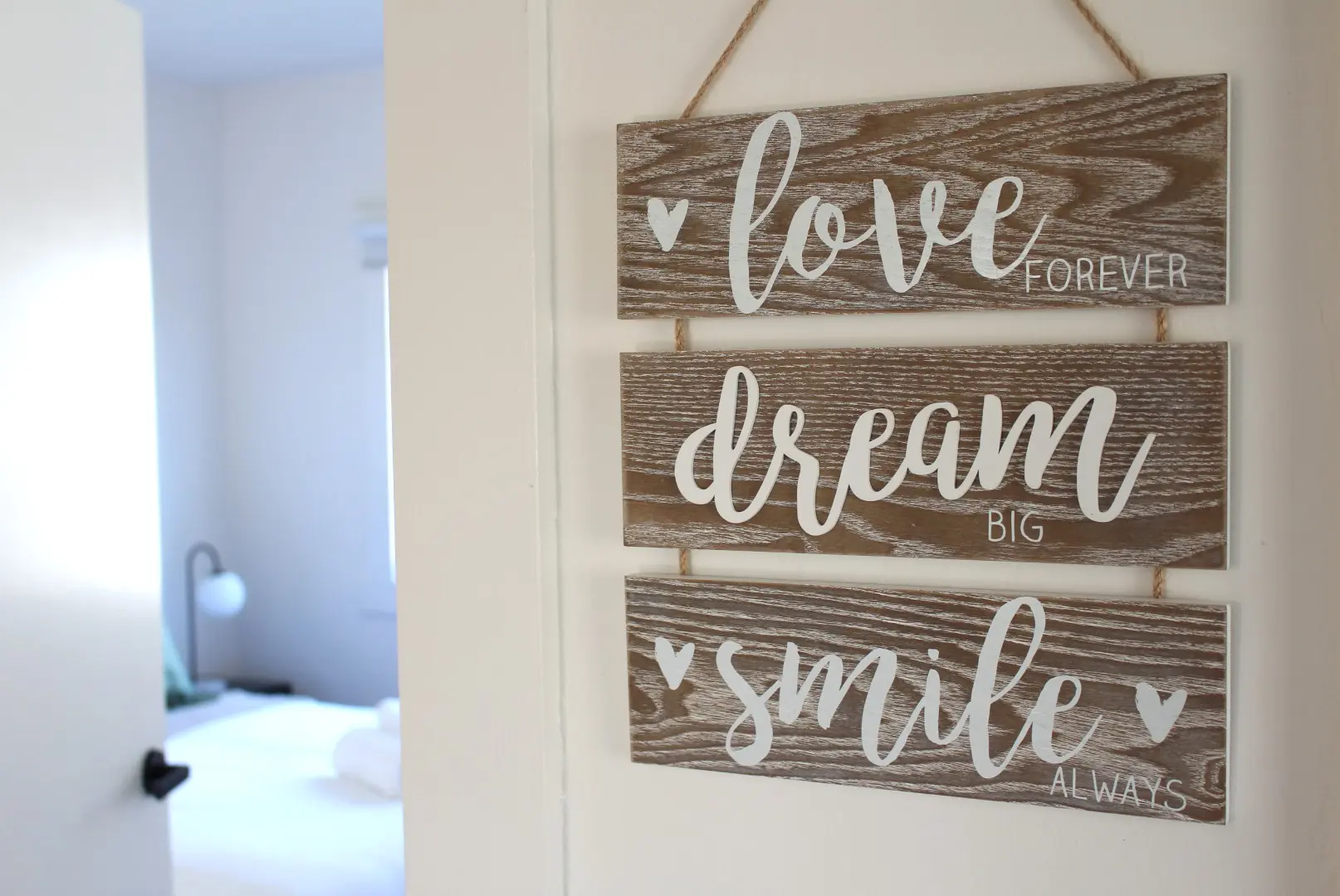 Decorative wooden signs with inspirational phrases.