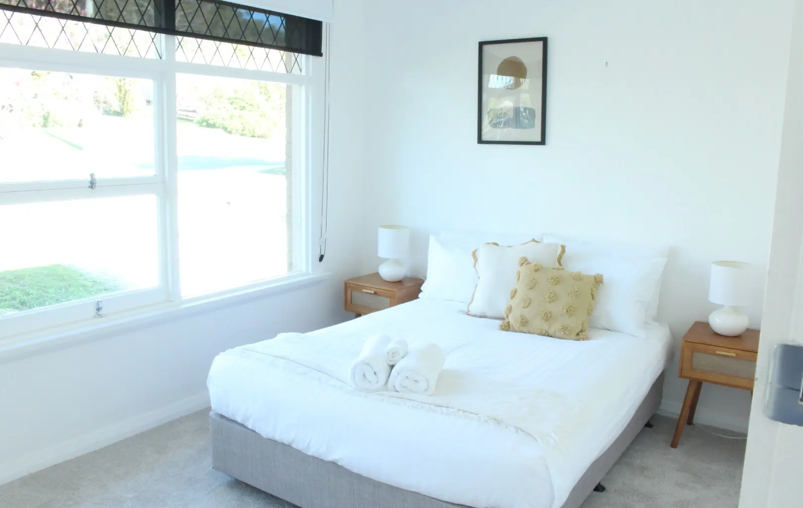 Bright, modern bedroom with stylish furnishings.
