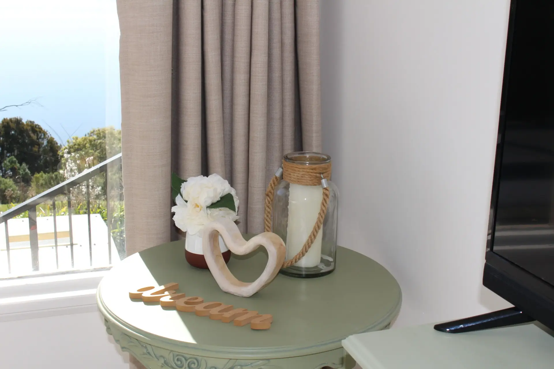 Decorative table with flowers and candle display.
