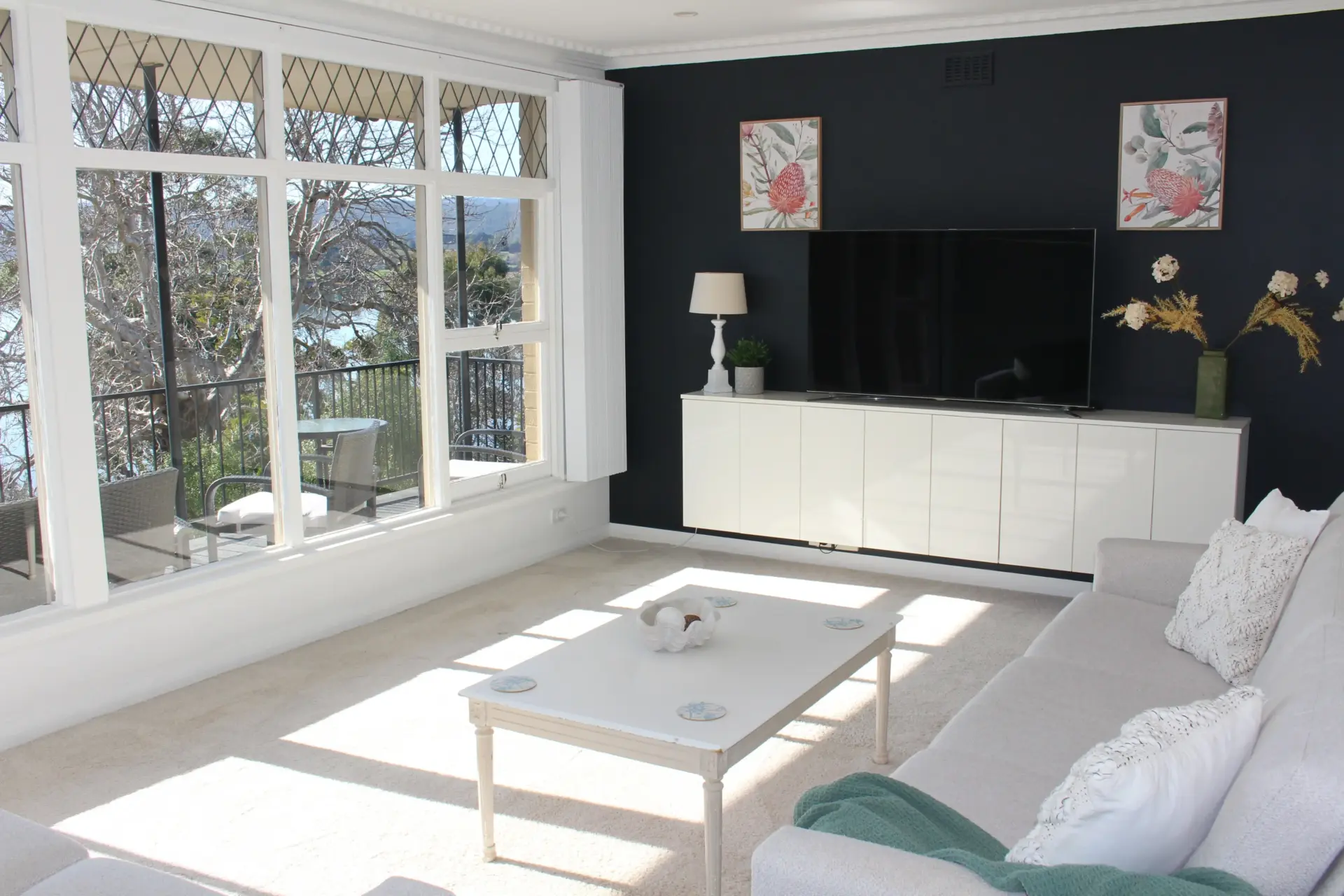 Bright living room with modern furnishings and views.