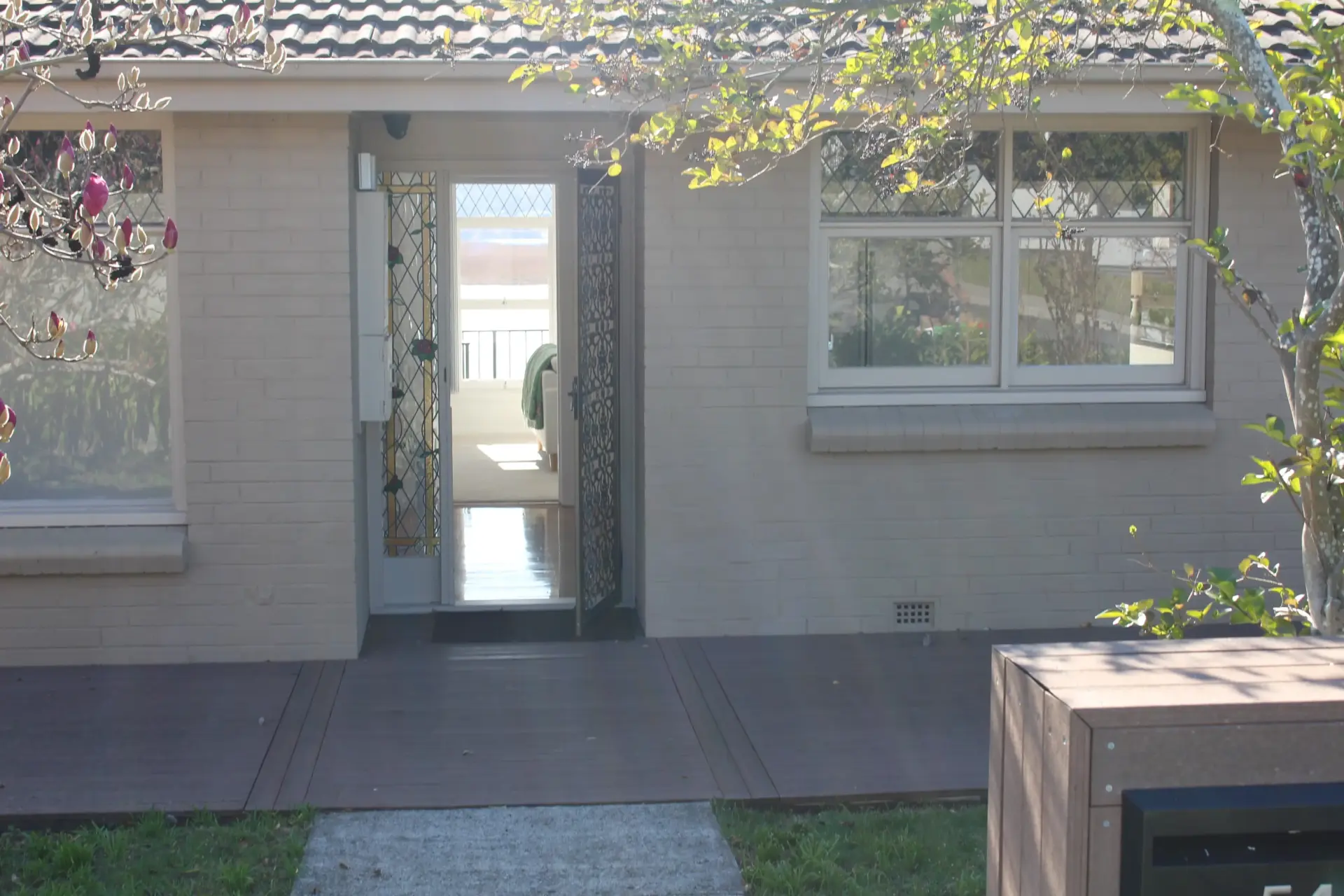 Front entryway of a house with greenery.