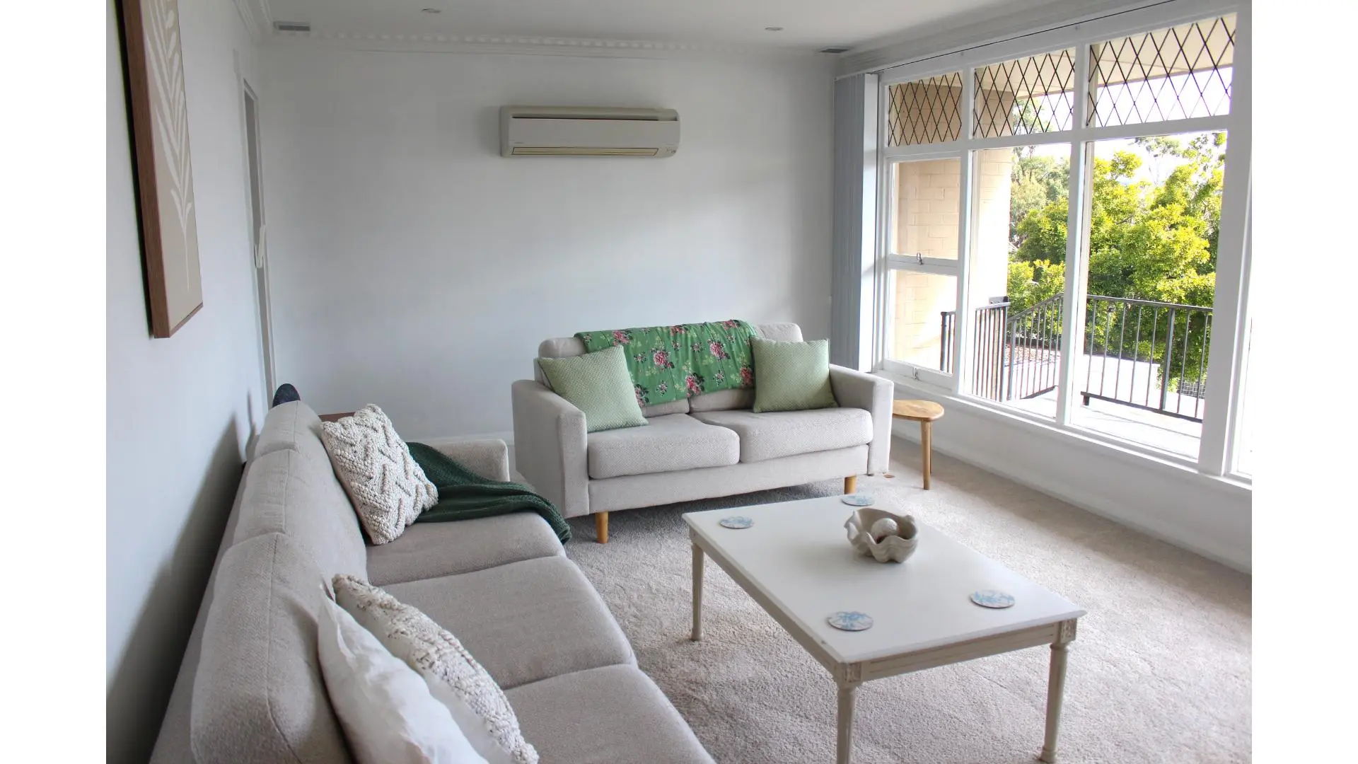 Bright and modern living room with comfortable seating.