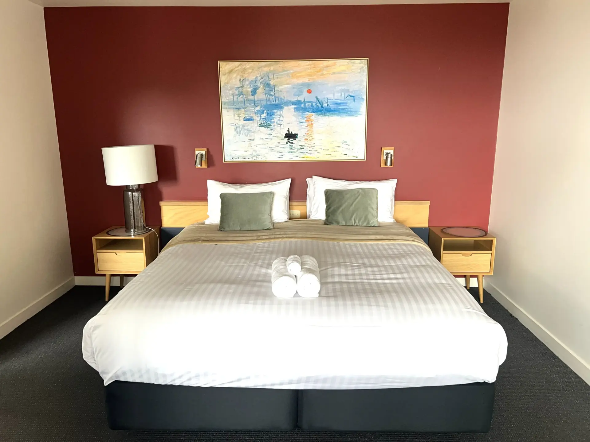 Modern bedroom with double bed and feature wall