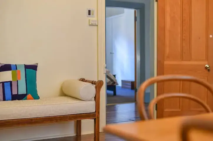 Cosy hallway with bench and open doorway