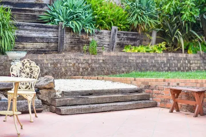 Backyard patio with steps and garden seating