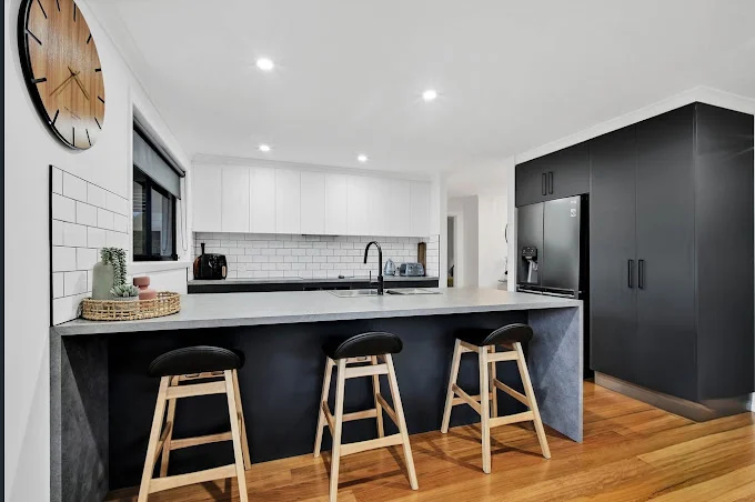 Modern kitchen with sleek design and bar stools