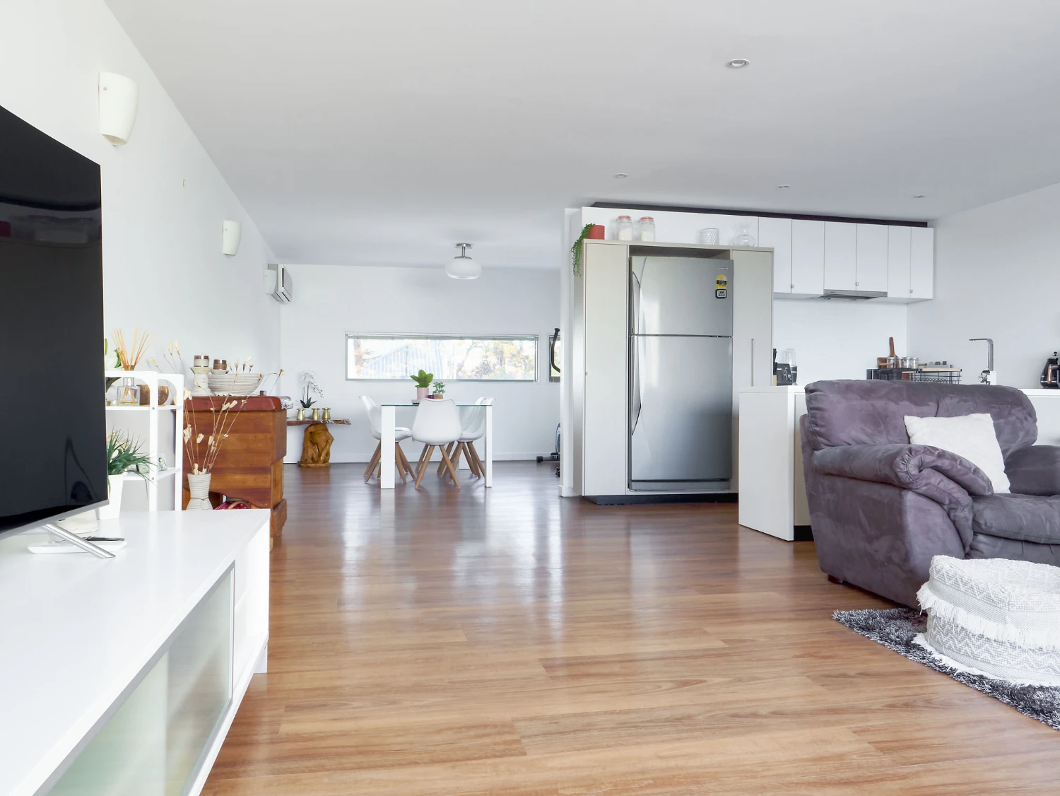 Modern open-plan living area with stylish furnishings.