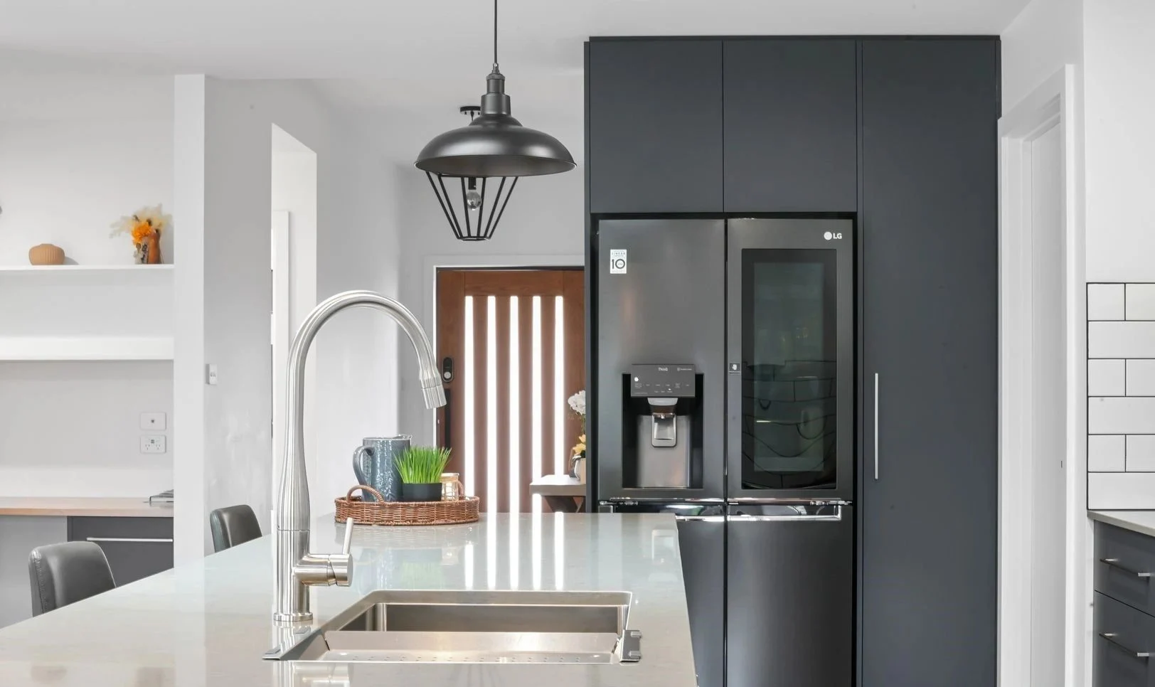 Modern kitchen featuring sleek design and appliances.