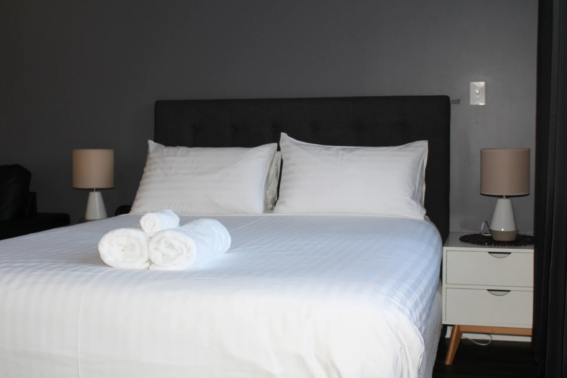 Cozy bedroom with neatly arranged towels.